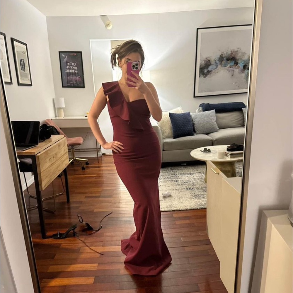 Likely burgundy gown